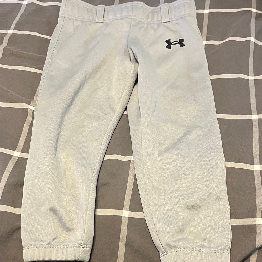 Under Armour Kids Light Gray baseball pants and a pair of Easton size yxxs